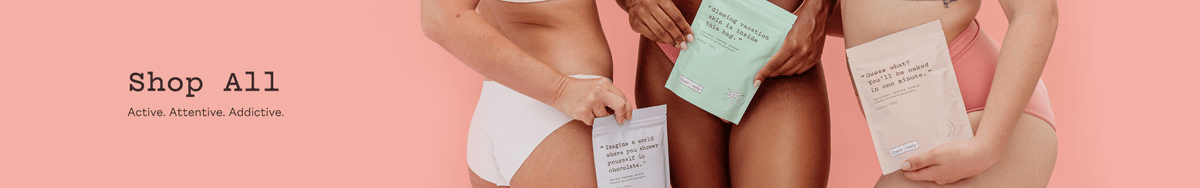 Shop All category banner: three women in pale underwear holding frank body scrub sachets on a coral background. Text reads: Shop All. Active. Attentive. Addictive.